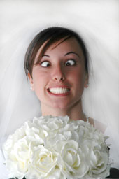 lovely bride smiling yet looking crazed with her eyes crossed