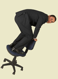 businessman standing on teetering office chair