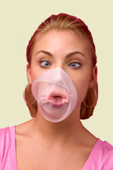 young woman with bubblegum popped all over her face