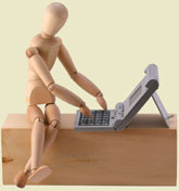mannequin typing into a laptop